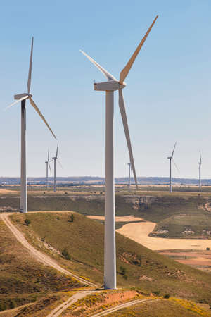 Wind turbines in the countryside. Clean alternative renewable energy. Vertical