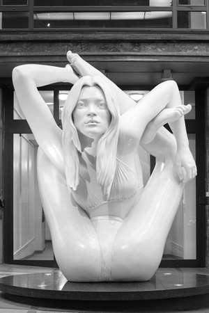 Contortionist woman sculpture in black and white. Oslo, Norway. Interior.