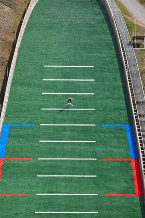 Ski jump. Artificial track. Sport background. Norwegian summer. Verticalの写真素材