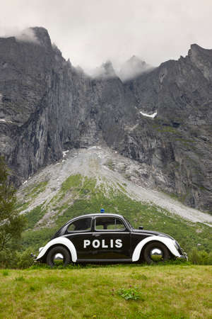 Norway landscape. Troll wall massif mountain Trollveggen. Antique police vehicle. Curiosityのeditorial素材