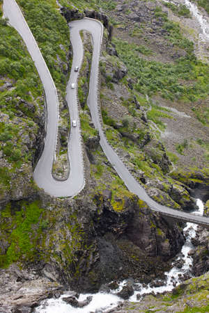 Norwegian mountain road. Trollstigen. Stigfossen waterfall. Norway tourist landscape valley....