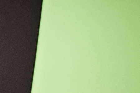 Colored cardboards background in green black tone. Copy space. Horizontal