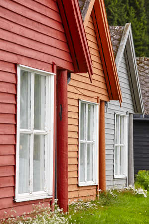 Traditional norwegian wooden colored cabin houses facades. Travel Norway.のeditorial素材