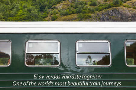 Flam train wagon in Norway. Norwegian mountain landscape. Tourism. Horizontal