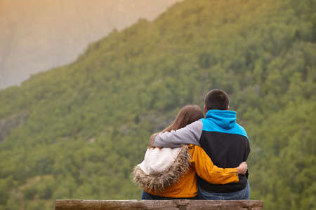 Youngs couples enjoying green forest at sunset. Norway landscape. Tourismの写真素材