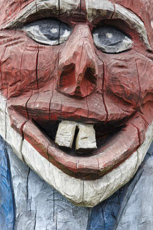 Norwegian carved wooden face detail troll. Scandinavian folklore. Norway. Verticalの写真素材