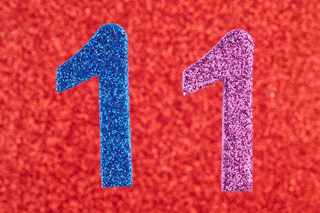 Number eleven blue purple color over a red background. Anniversary. Horizontal
