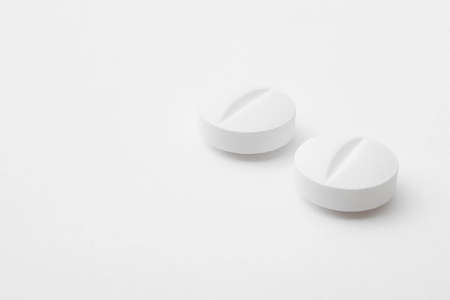Pills over a white background. Medicament treatment. Health care photoの写真素材