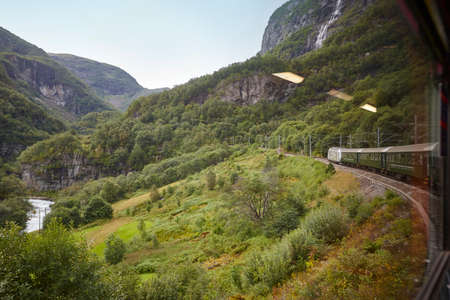 Flam train descent in Norway. Norwegian mountain landscape. Tourism. Horizontalの写真素材