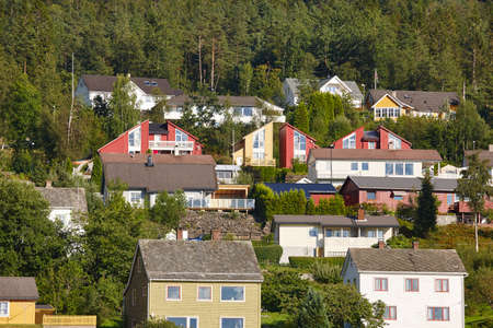 Traditional norwegian fjord village with forest. Hardanger route. Horizontalの写真素材