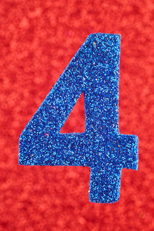 Number four blue color over a red background. Anniversary. Verticalの写真素材
