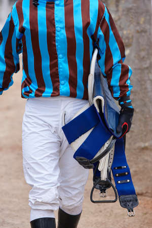 Jockey after the race. Hippodrome background. Racehorse. Competitionの写真素材