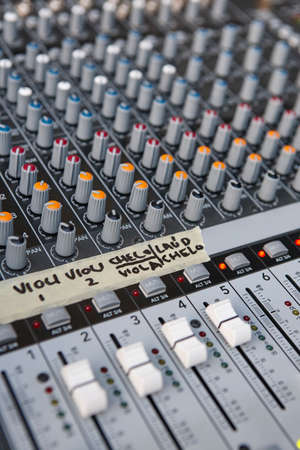 Mixing board panel equipment detail. Sound technology background. Vertical