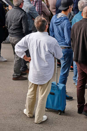 Traveler with baggage looking for information. People background. Transportationのeditorial素材