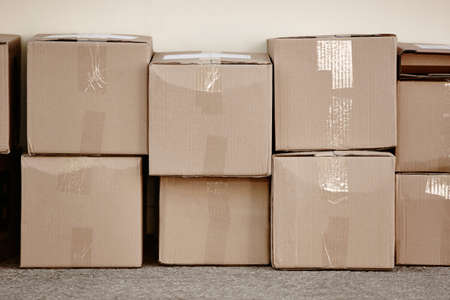 Stacked cardboard boxes. Delivery background. Copy space. Horizontalの写真素材