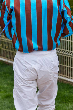 Jockey detail after the race. Hippodrome background. Racehorse. Competitionの写真素材