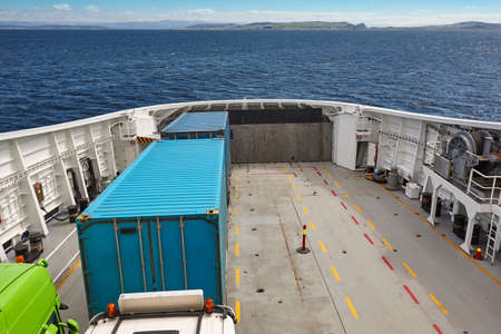 Norwegian ferry detail with trucks. Norway fjord landscape. Atlantic Ocean