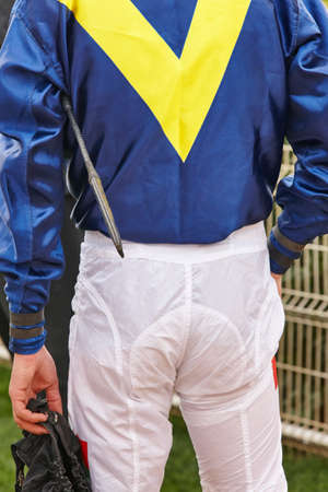 Jockey detail after the race. Hippodrome background. Racehorse. Competitionの写真素材