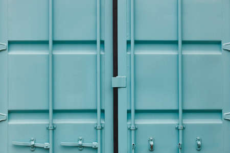 Cargo container doors in blue green tone. Delivery background. Horizontal