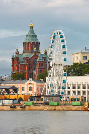 Helsinki skyline with harbor, wheel and Uspenki cathedral. Travel Finlandの写真素材