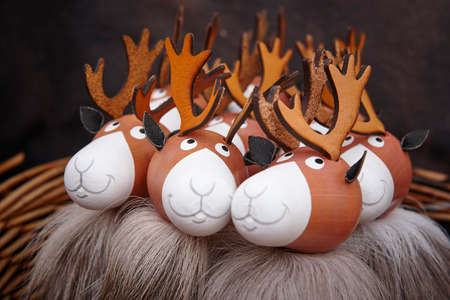 Painted wooden reindeers bundle. Christmas background celebration. Holiday season. Horizontal