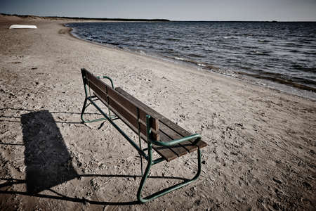 Sand beach with bench in Finland. Yyteri area. Summer holidaysの写真素材