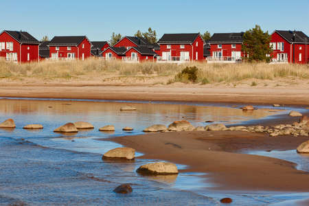 Red wooden houses near Marjaniemi beach, Hailuoto island. Finland. Travelの写真素材