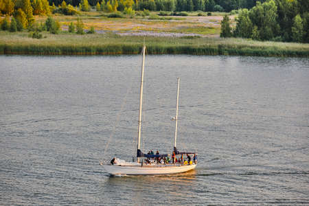Yacht sailing on a finnish lake. Finland summer recreation. Horizontalのeditorial素材