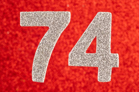 Number seventy-four silver color over a red background. Anniversary. Horizontal