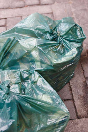 Garbage bags on the street. Recycle rubbish. Clean environment. Verticalの写真素材