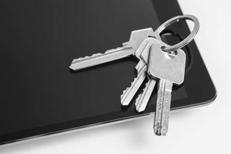 Tablet and home keys isolated on white. Buy, sell, rentの写真素材