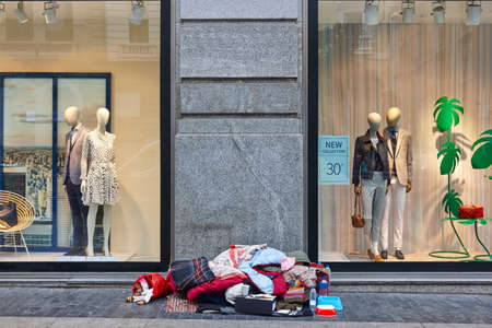 Homeless in the city. Urban loneliness. Misfortune unemployment. Charityの写真素材