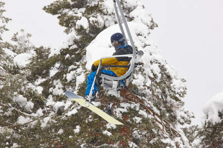 Ski lift and slope on a snow landscape. Winter sport. Horizontal