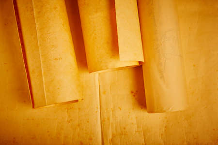Old aged blank rolled parchments. Antique documents. Vintage manuscripts. Horizontalの写真素材