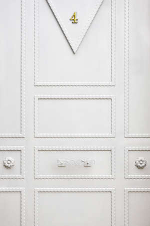White metallic classic door detail. Home entrance background. Verticalの写真素材