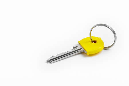 Key ring with keys over white background. Rent, buyの写真素材