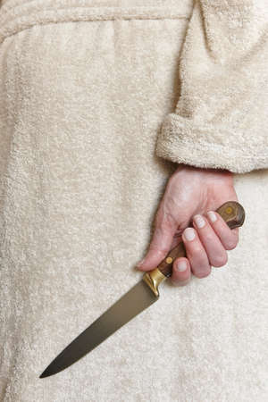 Killer woman with a knife. Violence aggression. Criminal murderer. Assassinの写真素材
