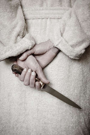 Killer woman with a knife. Violence aggression. Criminal murderer. Assassinの写真素材