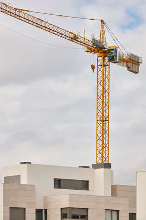 Modern building and crane machinery structure. Construction industry. Horizontalの写真素材