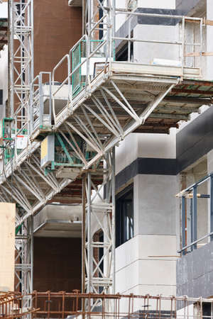 Building facade under construction. Concrete structure. Architecture. Vertical