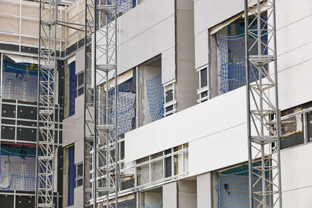Building facade under construction. Insulation material and tiles. Horizontalの写真素材
