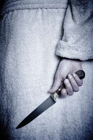 Killer woman with a knife. Violence aggression. Criminal murderer. Assassinの写真素材