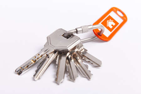 Key ring with keys over white background. Rent, buy