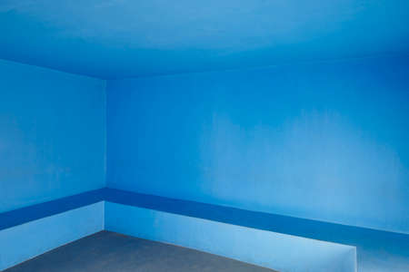 Blue concrete walls indoor room. Minimalist interior architecture. Horizontalの写真素材