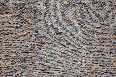 Slate pieces on a rooftop. Stone grunge textured background. Copyspaceの写真素材