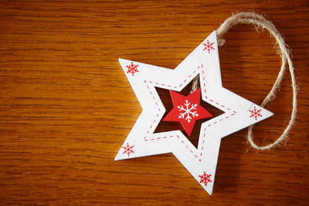 Christmas handmade wooden figure in red and white color. Decoration