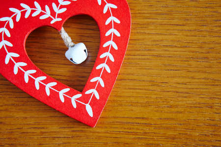 Christmas handmade wooden heart in red and white color. Decoration