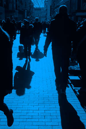 People on the street. Urban crowd in blue tone. Verticalの写真素材