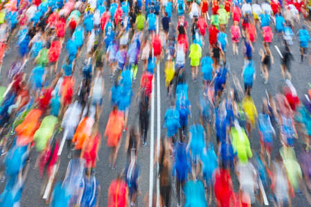 Runners on the street. Athletes in motion. Urban competition. Horizontalの写真素材
