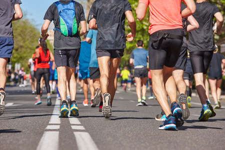 Marathon runners on the street. Healthy lifestyle. Urban athlete endurance